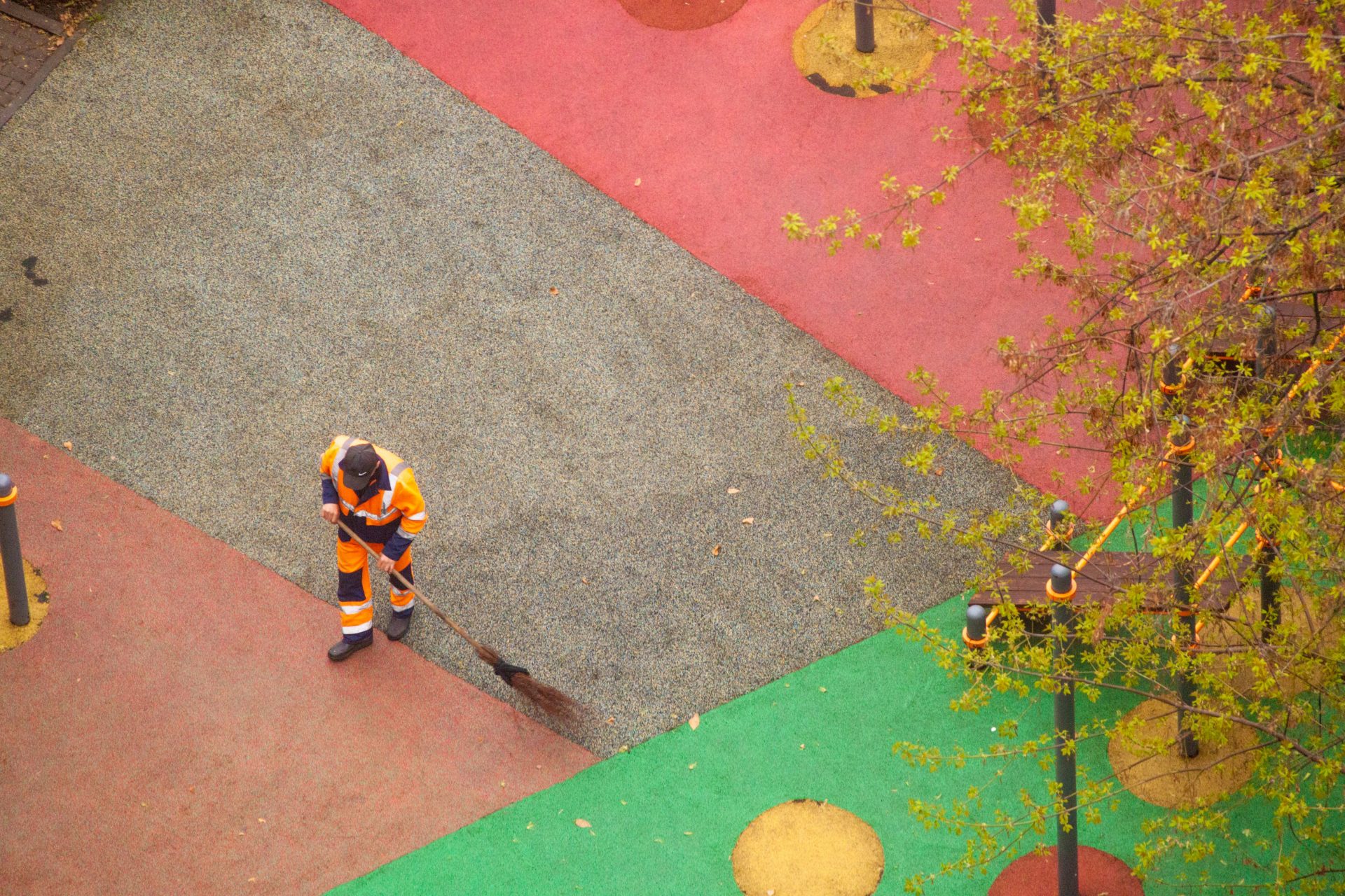 An aerial view of a man in an orange and black uniform